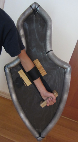 Shield arm